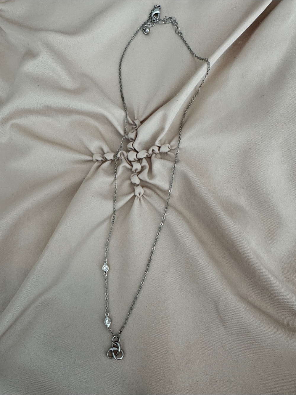 Delicate Silver Knot Pendant Necklace with Crystal Accents